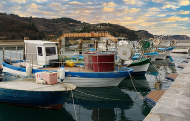 Obraz premium Moored fishing boats at sunset near Strunjan, Slovenia