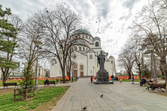 Belgrade, Serbia - March 28, 2021: Saint Sava Cathedral Temple (Hram Svetog Save) and the statue dedicated to Sveti Sava in Belgrade, Serbia.