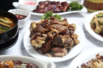 Freshly cooked Filipino food called Crispy Pata or deep fried crispy pork leg