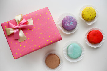 sweet dessert. macarons, gift box and a bouquet of flowers. 
