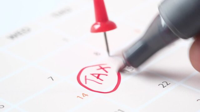 tax day concept with red circle on calendar date 