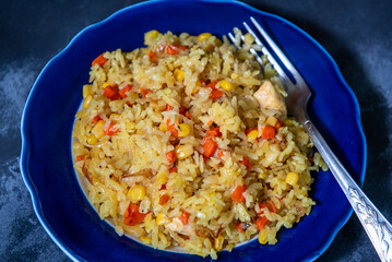 Risotto with chicken and vegetables. A plate of rice with vegetables. Selective focus.