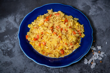 Risotto with chicken and vegetables. A plate of rice with vegetables. Selective focus.