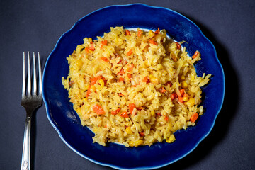 Risotto with chicken and vegetables. A plate of rice with vegetables. Selective focus.
