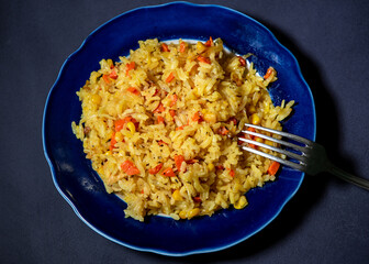Risotto with chicken and vegetables. A plate of rice with vegetables. Selective focus.