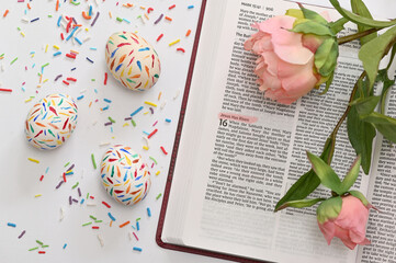 Sprinkle Easter Eggs and Peony Over The Open  Bible