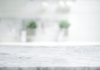 Selective focus.Marble table top on blur white kitchen room background. - Powered by Adobe