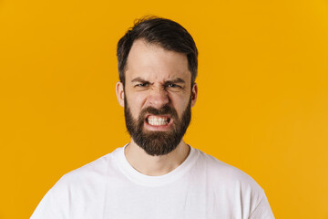Obraz premium Portrait of an angry brunette bearded man