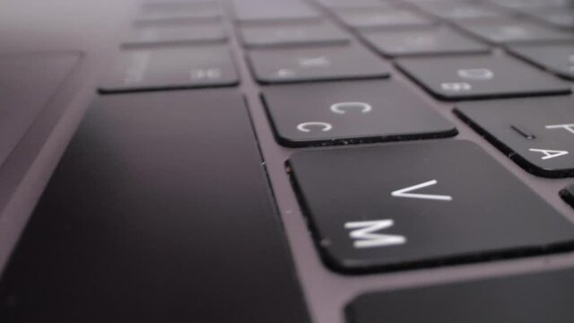 Woman typing. Extreme close up on Laowa 24mm