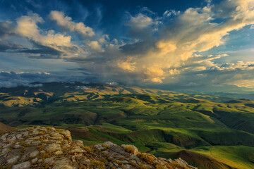 Sunset on hills in Caucasus mountains