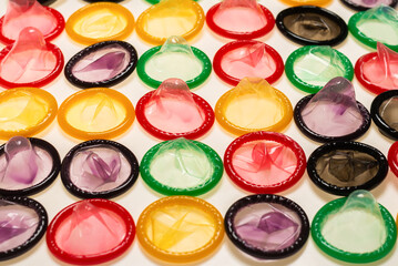 Colorful condoms background.