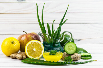 A curative mask is in a jug, leaves aloe, vegetables and fruit, applied in manipulation treatments...