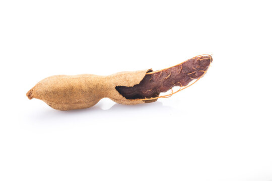 Tamarind (Tamarindus indica) fruit isolated on white background