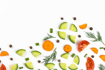 The vegetables cut by pieces are isolated on a white background.