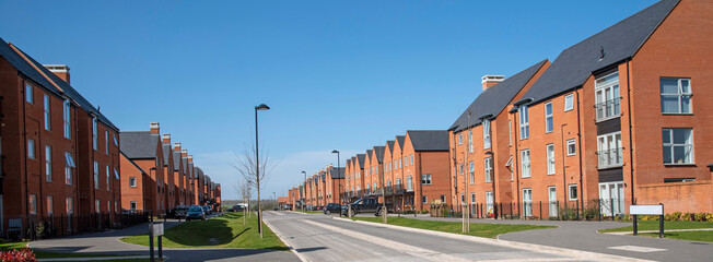 Winchester, Hampshire, England,UK. 2021.  New build homes against a blue sky in Winchester,...