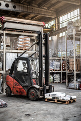 Fototapeta na wymiar Forklift in the warehouse