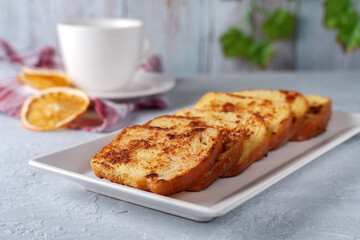 French toast with tea on a gray background. Healthy breakfast concept.