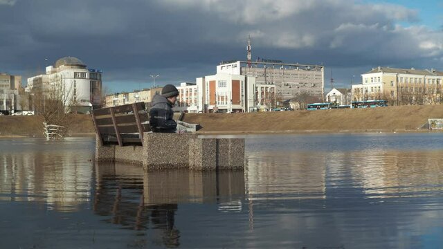 the city of Tver. April 2021. flooding of the city. a flooded park, shops with trees in the water
