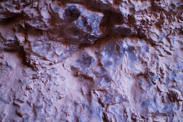 Reddish clay texture with desert salt crystals