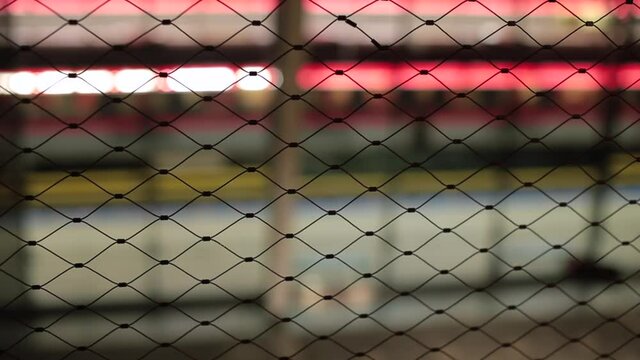 The subway fence. Protection of public transport pedestrians from danger. Train movement in bokeh.