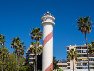 Marbella lighthouse, Costa del Sol, Spain. Lighthouse sourranded by plam trees