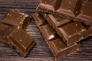 chocolate bars on wooden table top view