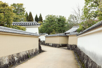 Fototapeta premium Empty street and old castle walls in Japan