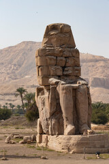 Colossi of Memnon - the ancient guardians of the temple of Amenhotep III at the entrance to the...