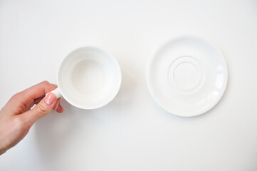 empty white cup with flowers on 8th March