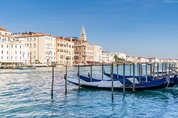 Fototapeta na wymiar Gondolas on the edge of the Grand Canal, Venice, Italy