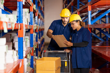 Group of male and female warehouse worker using clipboard checking products or parcel goods on...