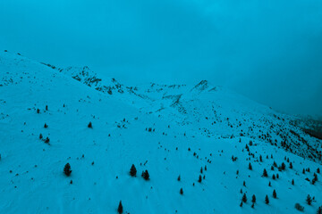 Amazing snow covered mountains, winter. Blue natural background.