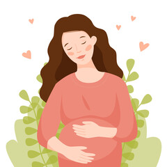 Happy pregnant woman hugs her belly. Girl on a background of leaves and hearts. 