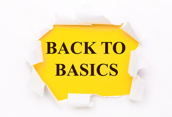 Torn white paper lies on a bright yellow background with the text BACK TO BASICS