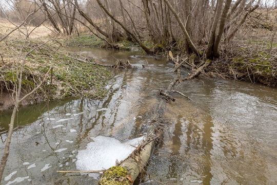 Discharge of untreated water into a natural river.  Pollution of the environment by sewage.