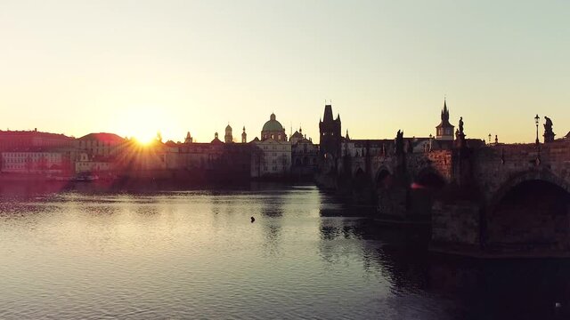 Aerial view of Prague Old Town architecture and Charles Bridge over Vltava river at sunset. Old Town of Prague, Czech Republic.