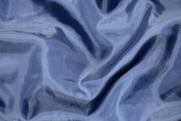 blue lining fabric, fabric texture, soft folds, center focus