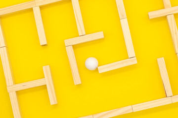 Maze or labyrinth made with white ballsin the middle.