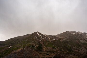 Panta de Sallente, in the Vall Fosca in the Pyrenees. On a day of early spring, cloudy and rainy. The swamp is quite empty, waiting to be filled with the melting of the mountains next door.