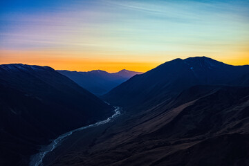 The river between the mountains view from the drone