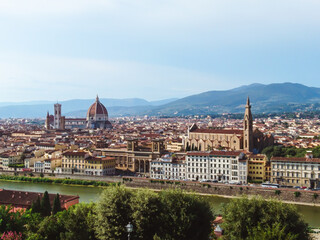 Panoramic cityscape of Florence on Arno river. Famous Cathedral of Santa Maria del Fiore, Basilicas, churches from Michelangelo terrace square. Sunny summer day view