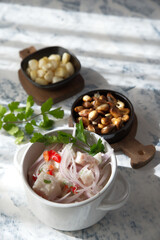 Very famous Peruvian dish that is made of chunky fish marinated in lemon and served as a starter.