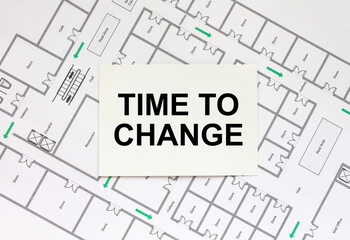 Business card with text Time To Change on a construction drawing