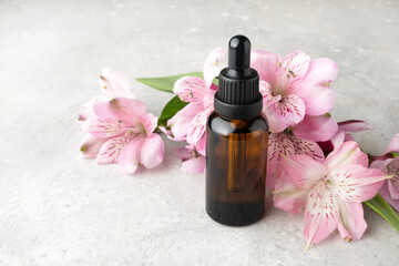 Cosmetics SPA branding mock-up. White cosmetic bottle containers with with pink exotic flowers on gray background. Natural organic beauty product concept, Minimalism style