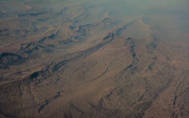aerial view of desert mountains and canyon. Rocky geological formations. Arabian Peninsula