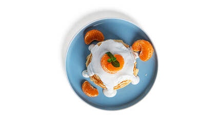 Fototapeta na wymiar Pancakes with white chocolate and tangerines isolated on a white background.