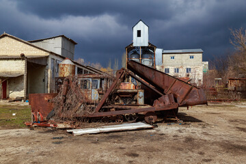 Devastation and decline in the agro-industrial sector. Cemetery of old rusty agricultural...