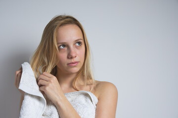 Young Wet Blonde Woman with White Towel