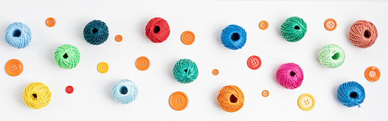 Diy, hobby, handwork concept. Tools and accessories for crafting and leisure. Bobins of threads and buttons. Banner