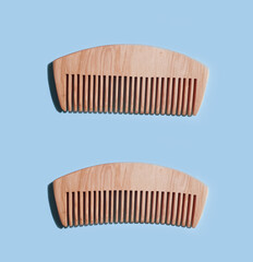 wooden comb on a colored background